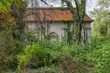 Fototapeta na wymiar Becej, Serbia - May 01, 2021: The summer house of the noble family Gombos left to the ravages of time. It was built at the beginning of the 20th century