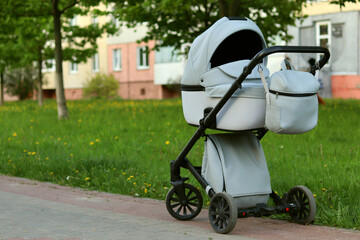Baby stroller in the park on a summer day