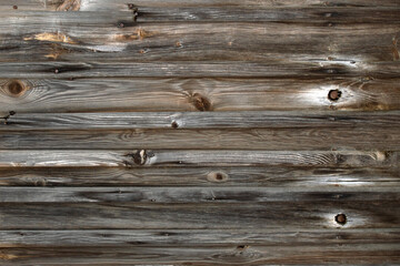 Wooden background from old boards with knots and nails