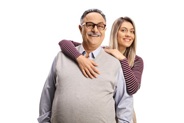 Daughter hugging her father and smiling at camera