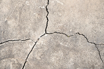 Obraz premium Concrete background with cracks. Gray cracked concrete.