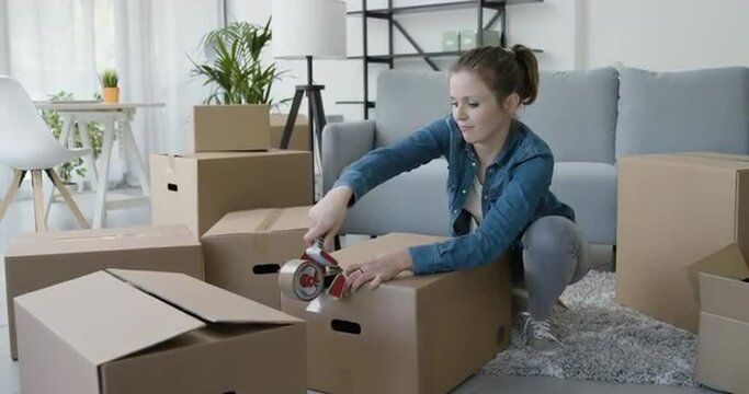 Woman packing in the living room