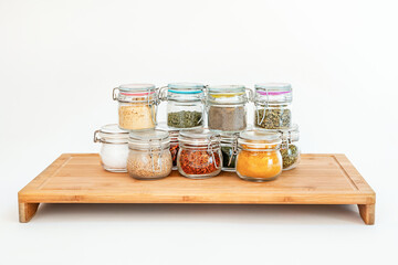 Image in studio photography of jars of assorted spices
