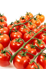 Image of bunch of cherry tomatoes on white background