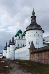 Fototapeta na wymiar Rostov Kremlin. The wall towers and Orthodox Church of St. John the Theologian. Rostov the Great, a popular travel destination of Russian tourist route Golden Ring. Russia