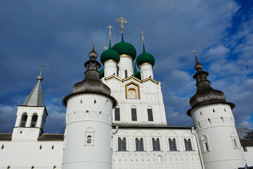 Fototapeta na wymiar Rostov Kremlin. The wall towers and Orthodox Church of St. John the Theologian. Rostov the Great, a popular travel destination of tourist route Golden Ring