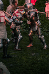 Knights fighting at sunset outdoors