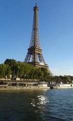 on  a boat trip on the river seine enjoy this beautiful landscape the eifel tower. paris, france.