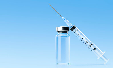 vaccine bottle and syringe on a light blue background