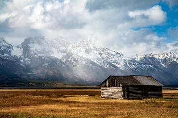 Fototapeta na wymiar historic Moulton barns n Mormons' Row against the dramatic Teton mountain range in Wyoming.