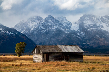 Fototapeta na wymiar historic Moulton barns n Mormons' Row against the dramatic Teton mountain range in Wyoming.