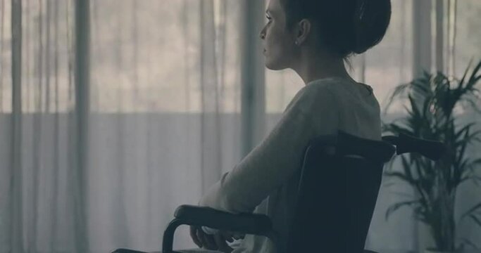 Sad lonely woman in wheelchair