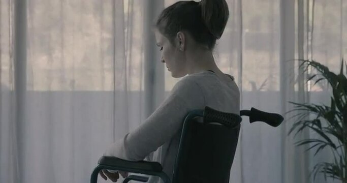 Sad lonely woman in wheelchair