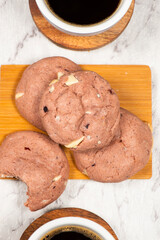 Freshly baked mixed berry and white chocolate cookies with cranberries, strawberries, raspberries and blueberries.