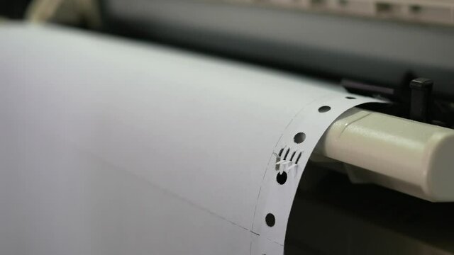 closeup of continuous paper printer in the office.