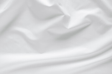 Abstract white fabric texture background. Cloth soft wave. Creases of satin, silk, and cotton.