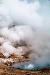 Fototapeta na wymiar steaming hot spring during a wintry autumn in Yellowstone National Park in Wyoming.