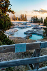 dramatic frosty and foggy autumn morning covering the yellowstone lake , hot sprinngs and cones in the West Thumb Geyser basin in Yellowstone national park in Wyoming.