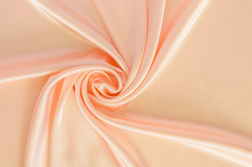 Elegant wavy and smooth orange satin cloth texture background. Abstract, texture and wedding concept.