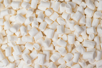 Fototapeta na wymiar Background of a large number of white marshmallows. Flat lay.