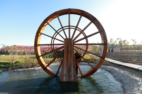 Wooden waterwheel architecture landscape in the park