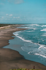 Waves on the beach with blue sky