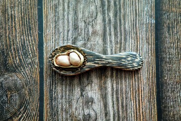Peanuts on wooden spoon.