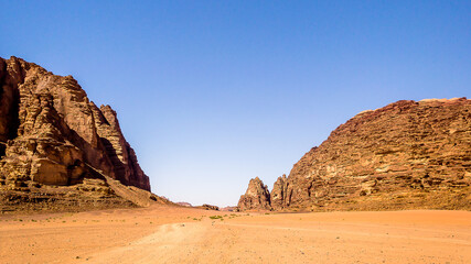 Wadi Rum (Valley of the Moon) red sand dunes, sandstone and granite rock view in southern Jordan. Wadi Rum Protected Area was named a UNESCO World Heritage Site in 2011