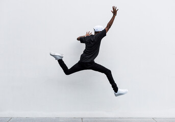 African man jumping in to the air