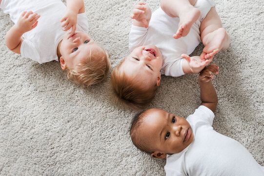 Babies lying on the floor