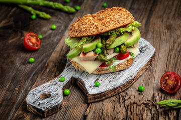 Delicious burgers with chicken fillet, asparagus, avocado, tomatoes, peas, cheese and tartar sauce....