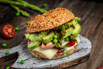 Close-up of homemade tasty burger on rustic wooden background. fast food and junk food concept