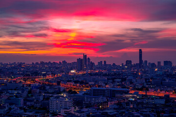 Fototapeta premium The blurred abstract background of the morning sun exposure to the tiny dust particles that surround the tall buildings in the capital, the long-term health issue of pollution.