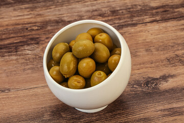 Green pickled olives in the bowl