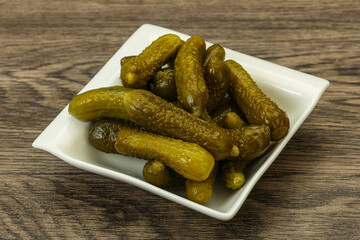 Pickled gherkin in the bowl
