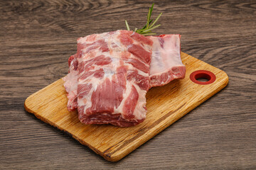 Raw pork ribs served rosemary