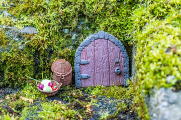 fairy house door made from clay in a wall miniature setup