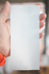 Paper receipt in hand