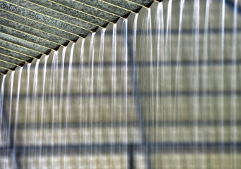 Pre-Monsoon Summer rains in May in Kerala, India. Copious amounts of water run drown from the...