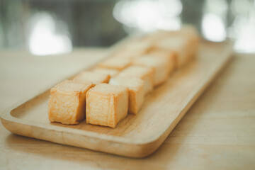Diced fish tofu in wooden plate
