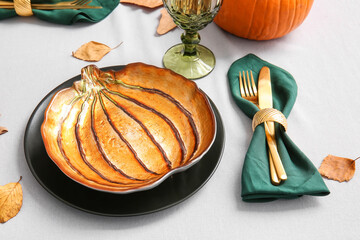 Beautiful table setting for Thanksgiving Day celebration on light background