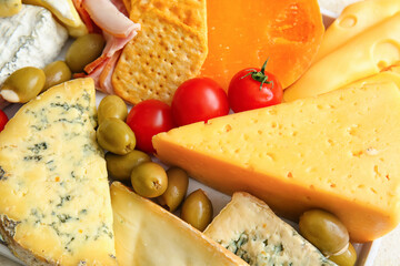Different types of cheese and snacks, closeup