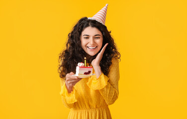 Beautiful woman celebrating birthday on color background