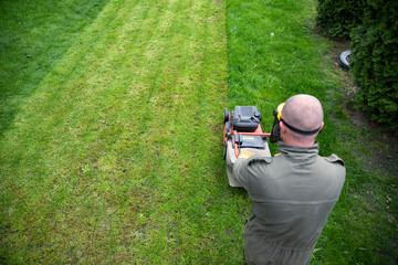 Lawn mover on green grass. Machine for cutting lawns.