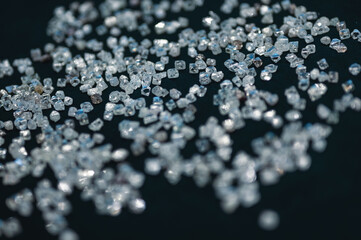 Close-up photo, a scattering of transparent diamonds on velvet