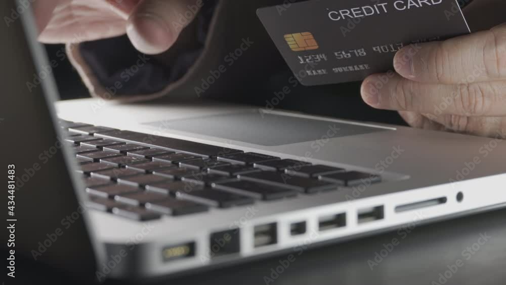 Poster close up shallow focus hand hold credit card and other hand key in keyboard. background for e-commer