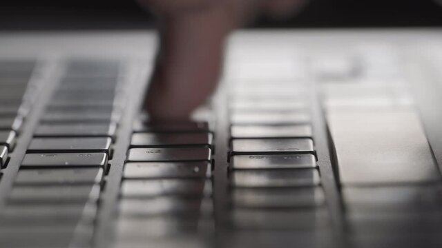 4K Video close up hand typing on notebook keyboard. Concept for office working and technology.