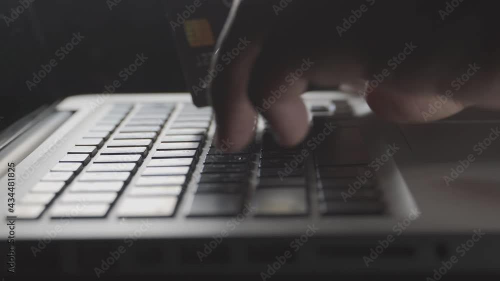 Poster close up shallow focus hand hold credit card and other hand key in keyboard. background for e-commer