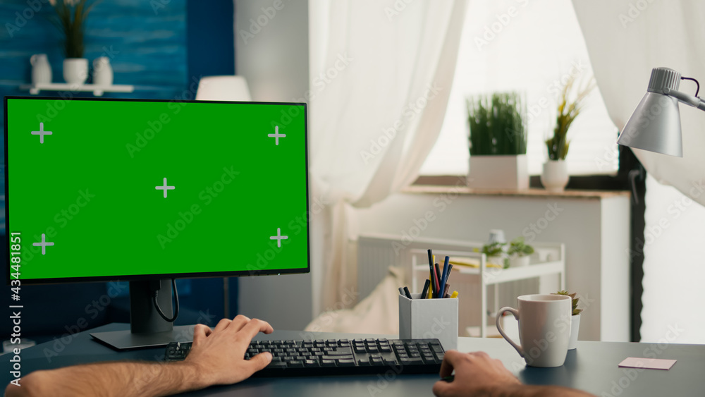Poster pov of man hands sitting on office desk using computer with mock up green screen chroma key working