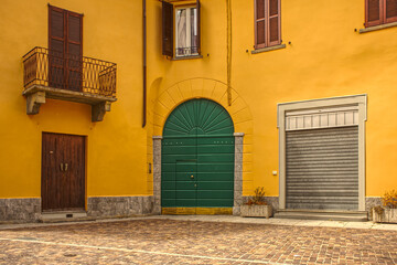 old town house with yellow facade in Angera in the province of Varese, Lombardy region in Italy